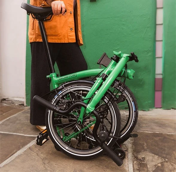 Folded Brompton bicycle in an official product photograph
