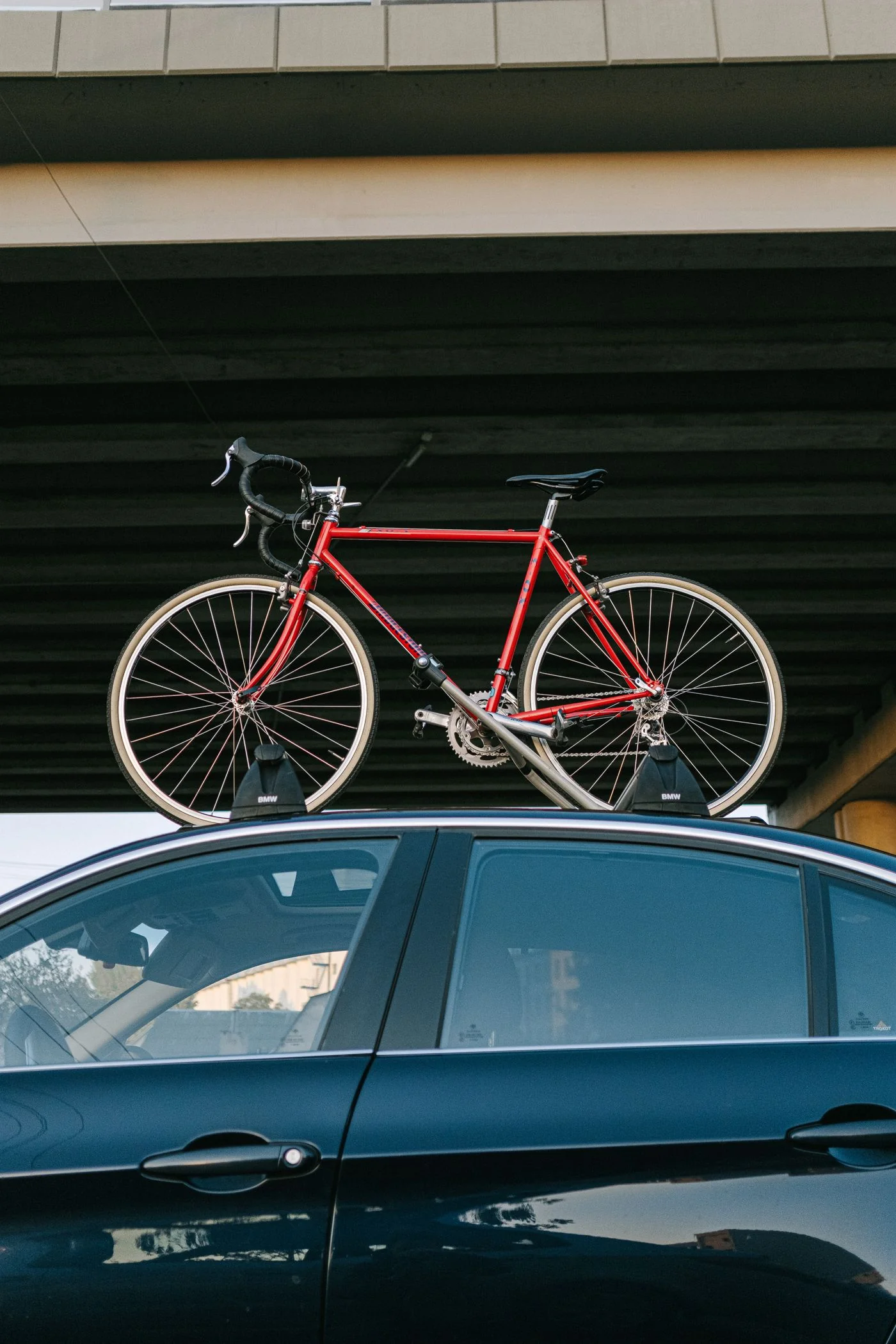 A bicycle on a car roof rack