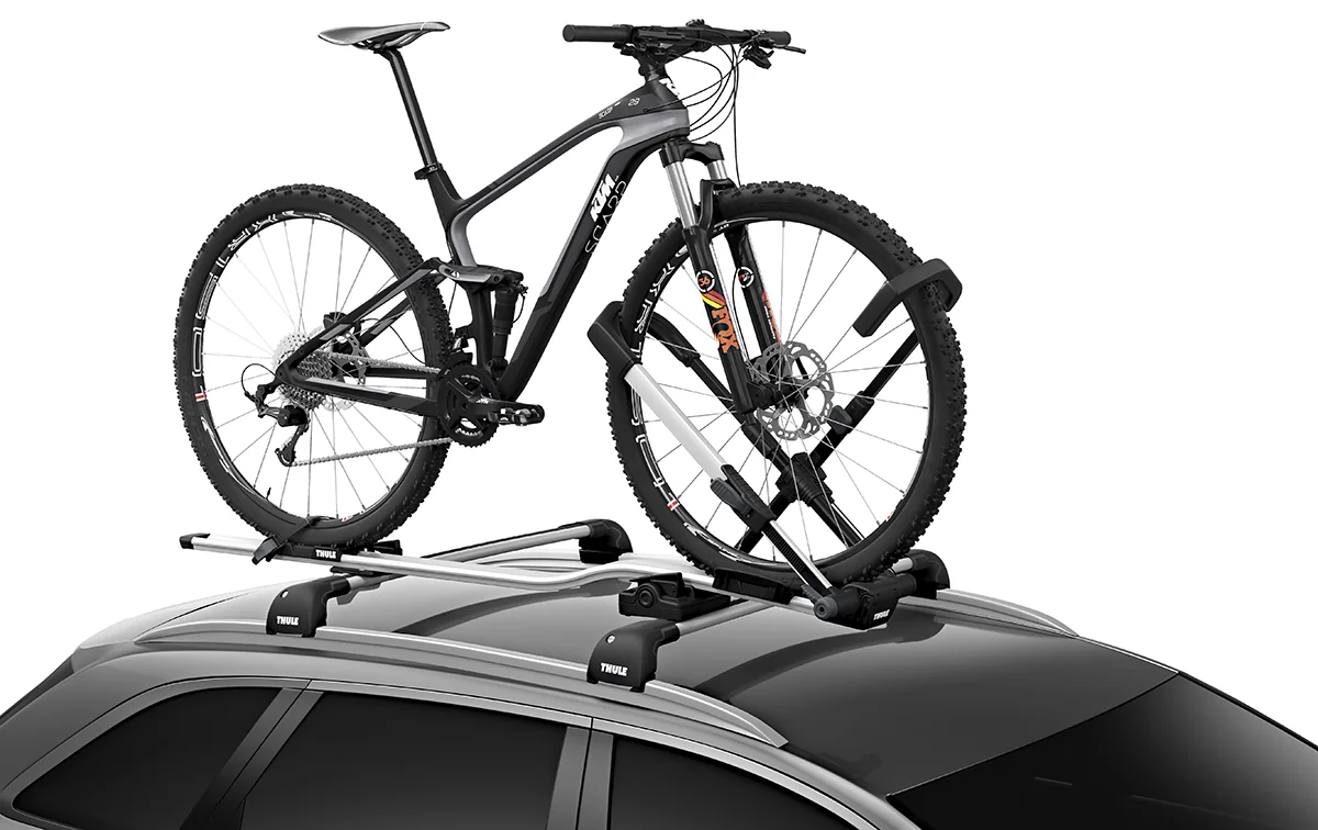 Thule UpRide holding a mountain bike on a car roof