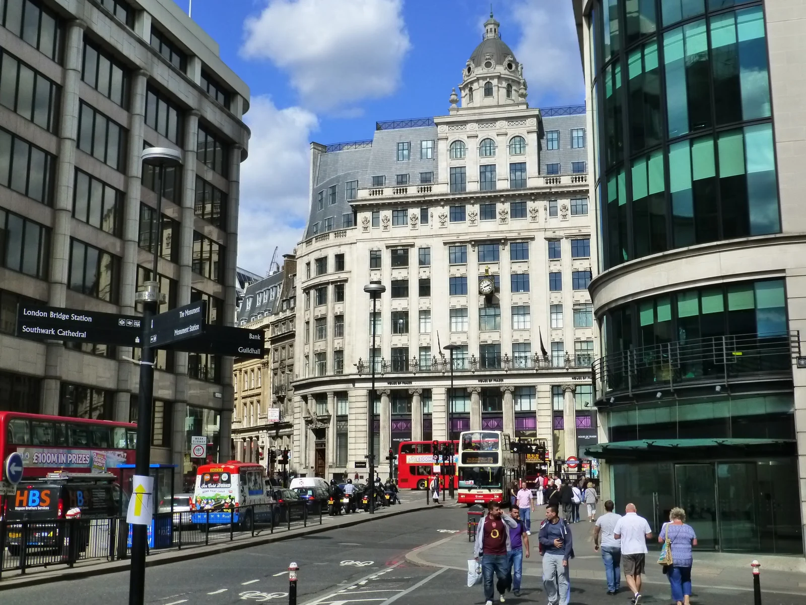 King William Street looking towards the busy Monument junction, with buses and pedestrians