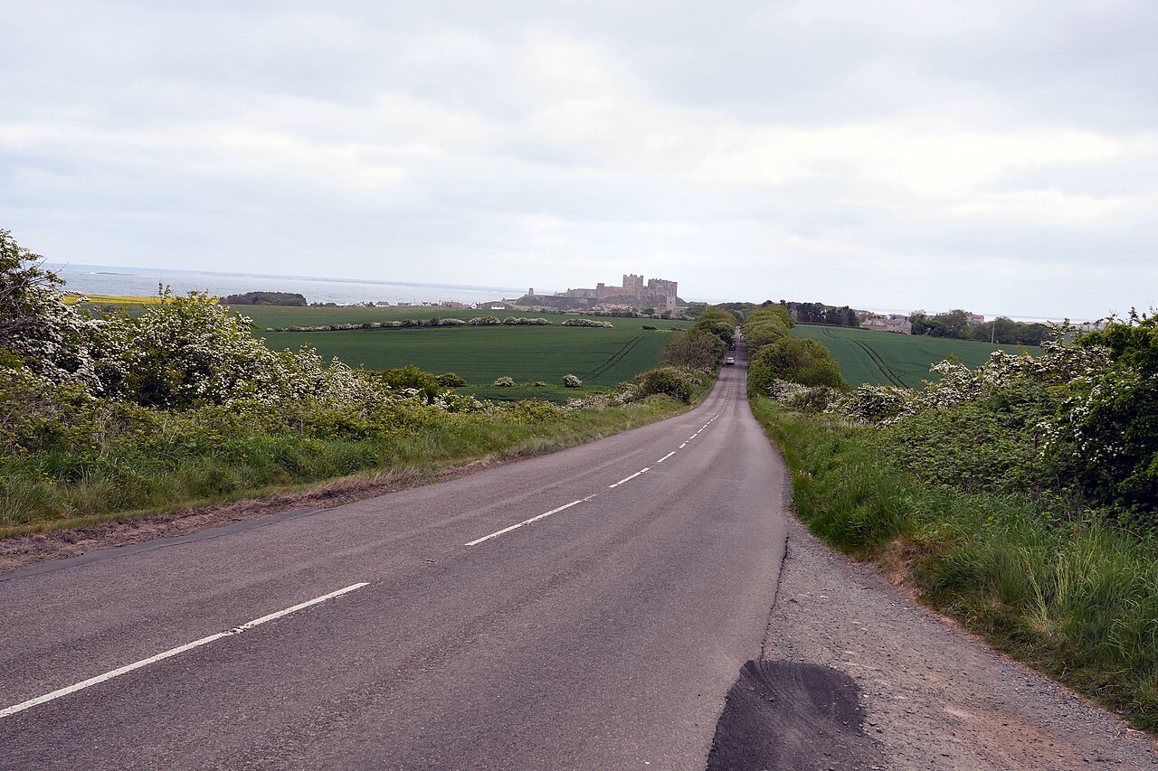 A road approaching Bamburgh Castle in Northumberland